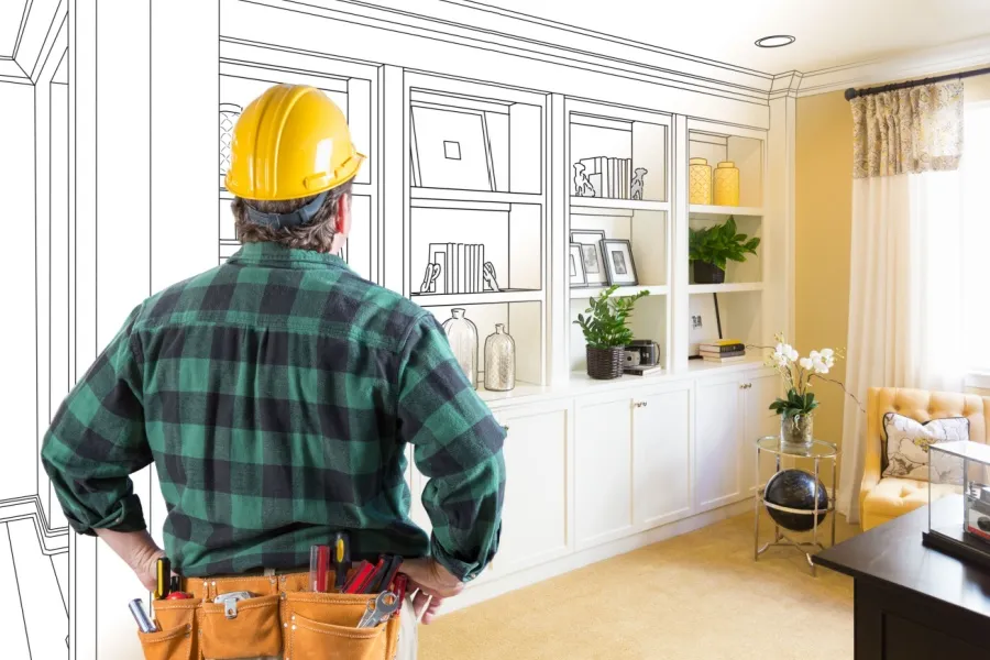 Interioristas imaginando como quedaría un mueble que estan imaginando justo en ese lugar de la habitación